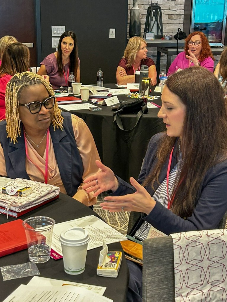 Two women talk at CUWLA's 2025 Connect event