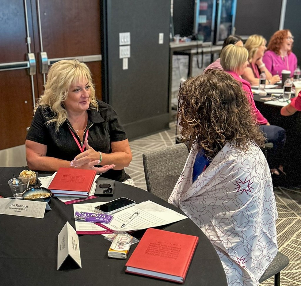 Two women CEOs sit in deep conversation.